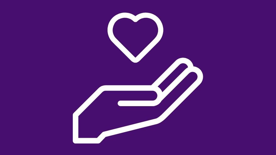 White hand holding a heart icon on purple background