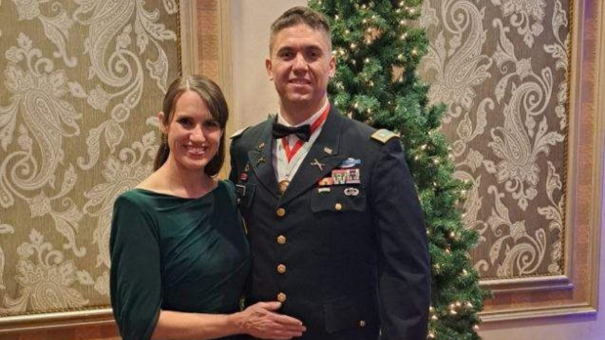 Woman standing next to a man
