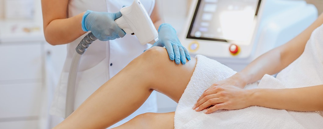 Women getting laser treatment on her leg