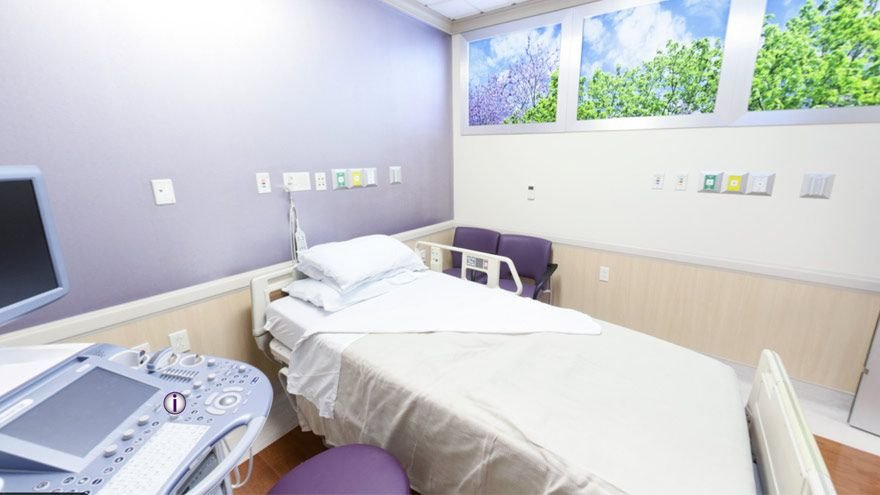 A section of Renown’s Labor Assessment Area, including a bed and computer.