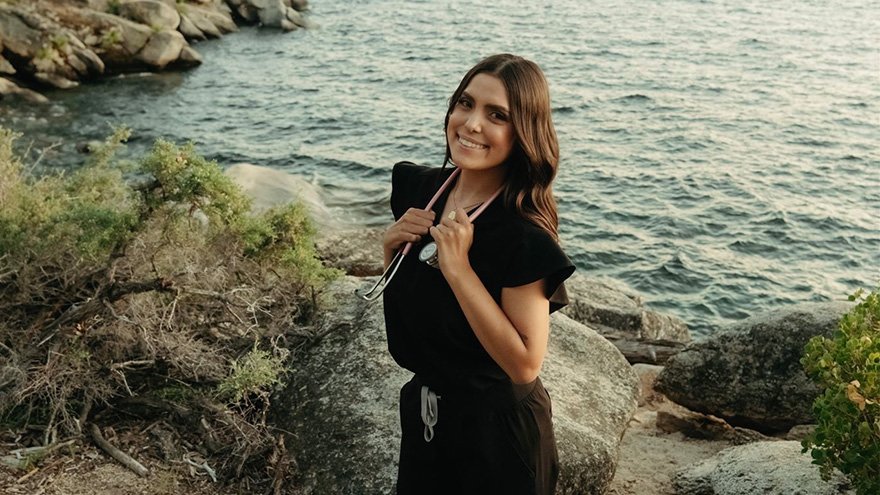 Andrea Riggio posing in front of lake