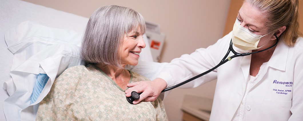Renown provider checking patient for COVID-19 symptoms