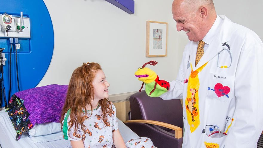 A doctor checking in on a child patient