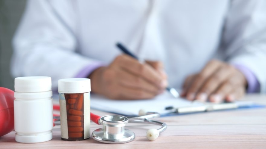 Psychiatric Provider writing a prescription for a patient