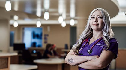 Renown nurse standing with arms crossed
