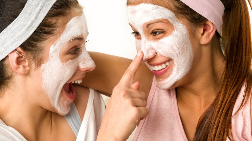 Mom and daughter having fun with face masks