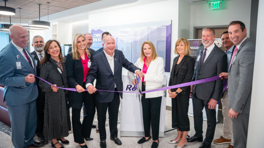 Renown Health board members and leaders along with Jeanne and Raymond Conrad cut the ribbon to open the Conrad Breast Center