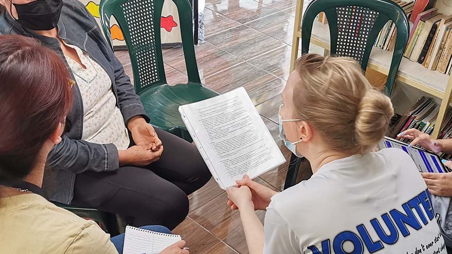 Volunteer talking to patient
