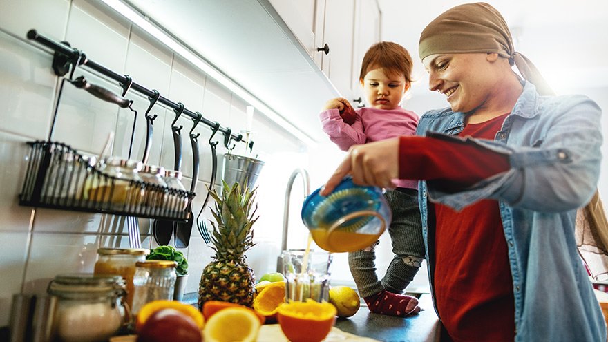Mom and daughter in kitchen preparing a healthy breakfast