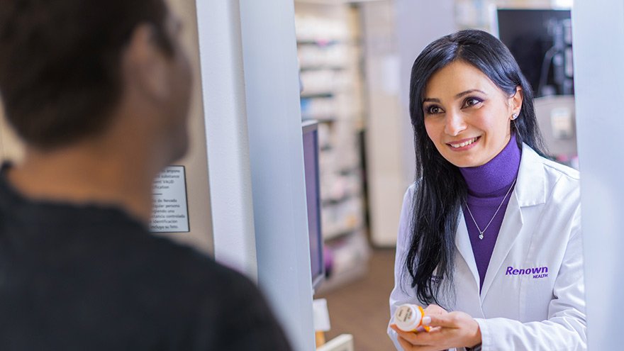 Renown pharmacist assisting patient