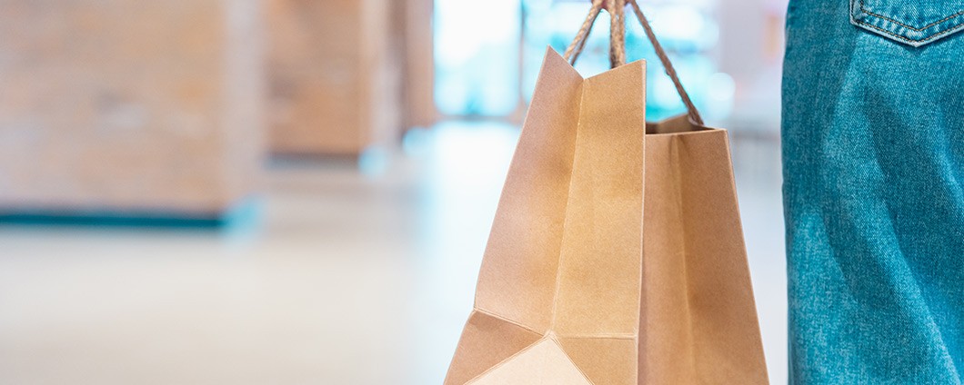 Woman walking holding gift bags