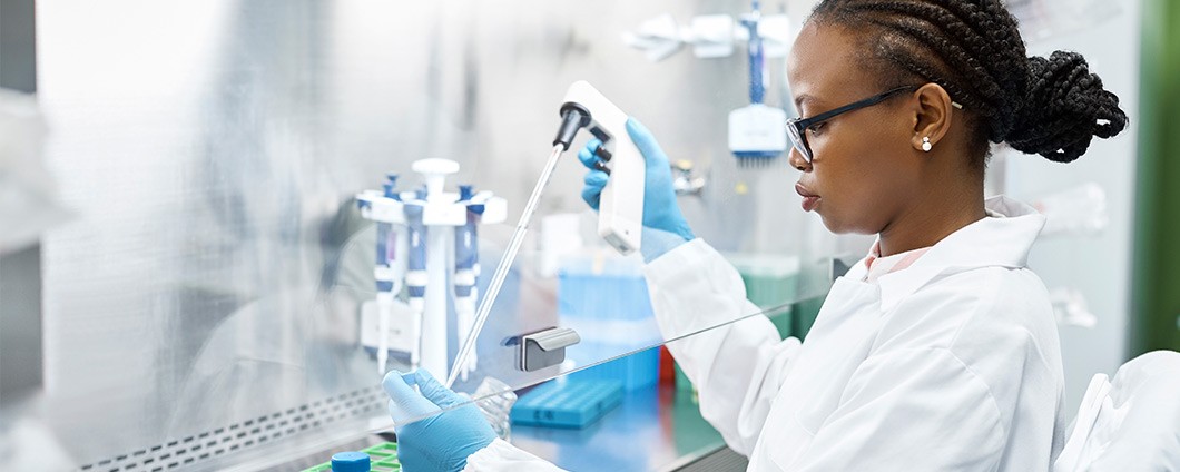 Scientist analyzing medical sample in laboratory