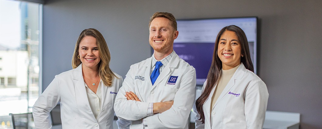 Women's health providers posing in white coats.