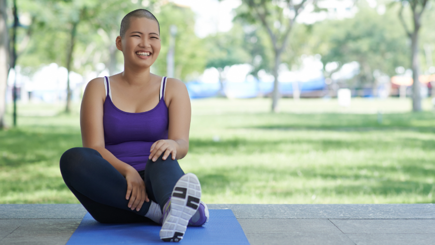 Young woman doing yoga in the park