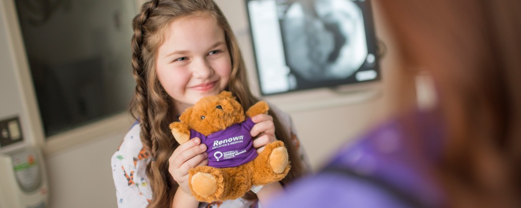 Renown Health pediatric patient holding teddy bear