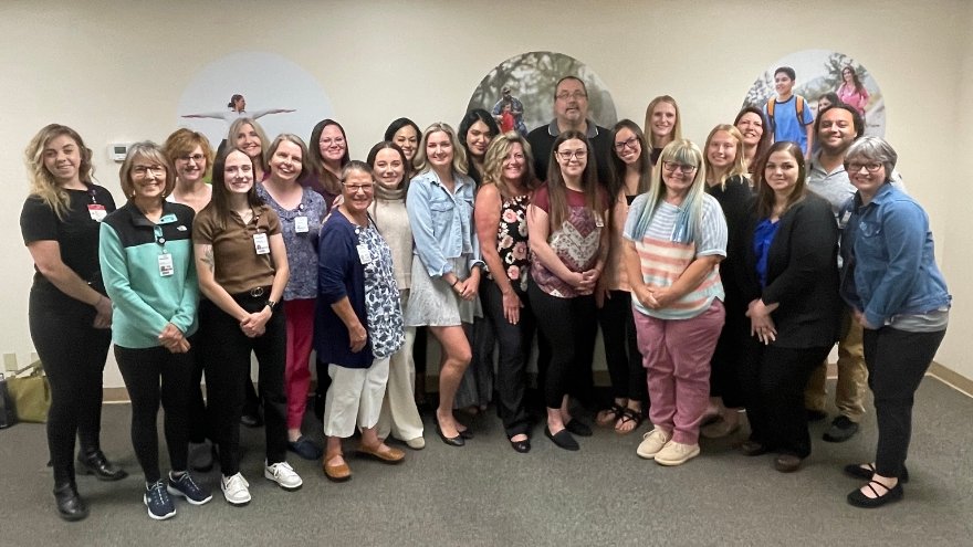 The Community Care Management department at Renown Health pose for a group photo.