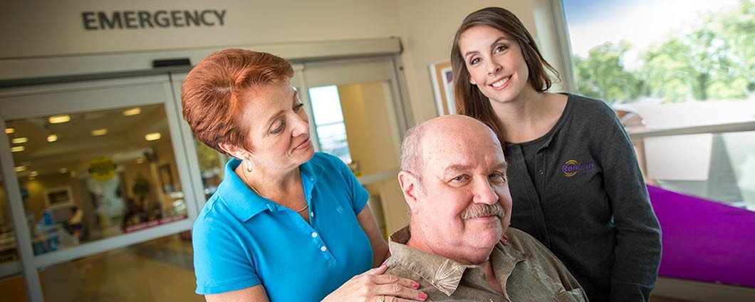 Renown employee escorts patient and wife out of the Emergency Room