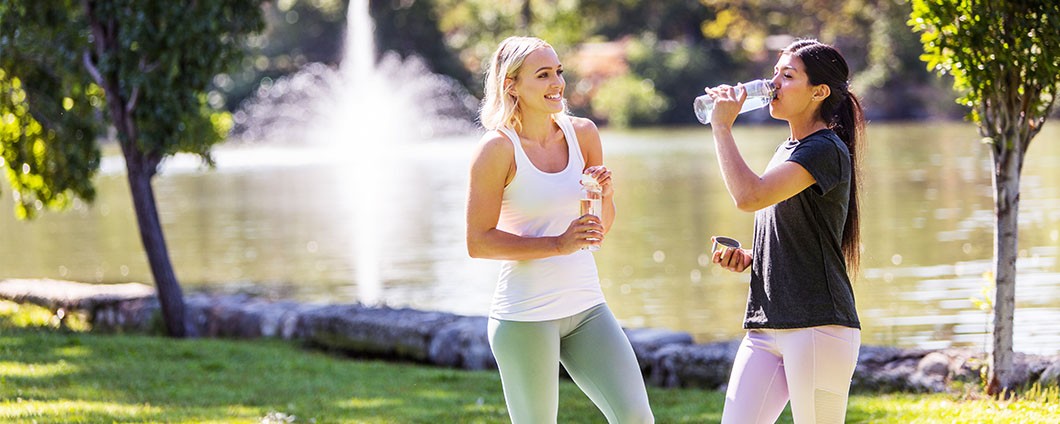 women in park exercising