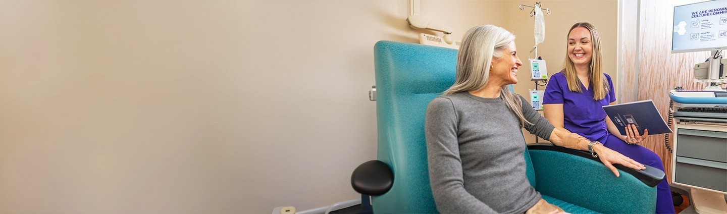 Renown nurse sits with oncology patient