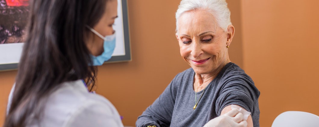 Patient receiving flu shot from Renown provider