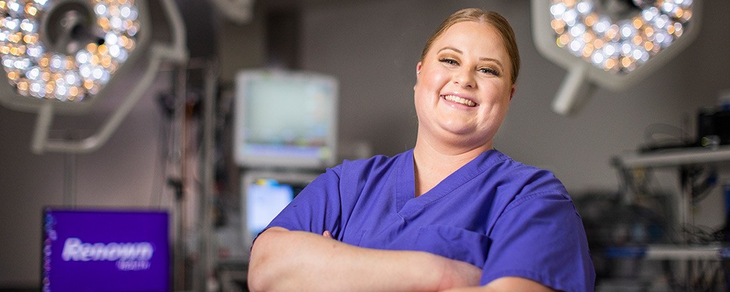 Renown employee smiling in operating room