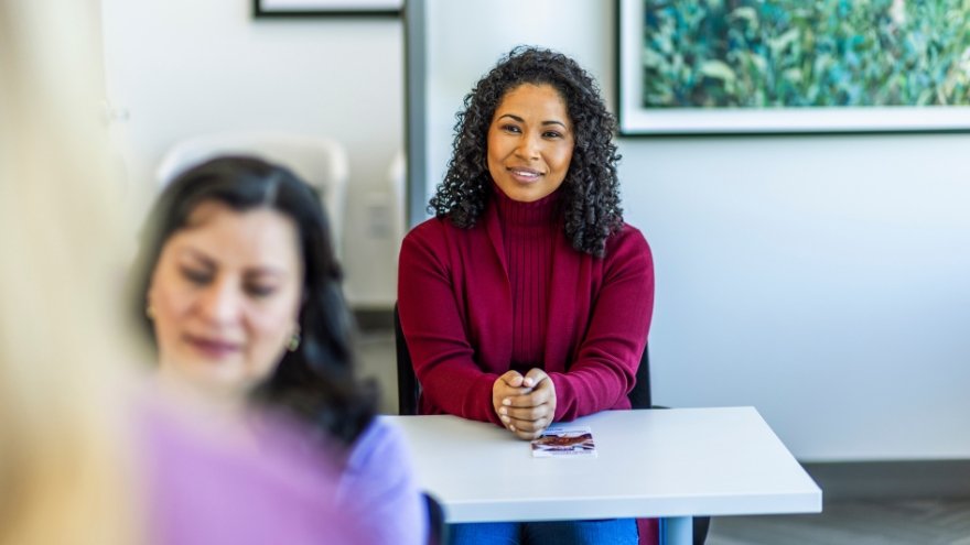 Woman sitting in professional development class.