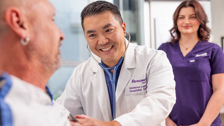 Renown Hospitalist Dr. Henderson Lopez, examines patient in ER