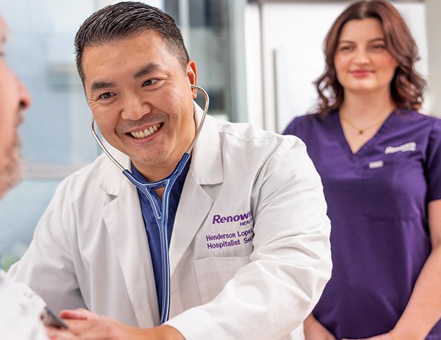 Renown Hospitalist Dr. Henderson Lopez, examines patient in ER