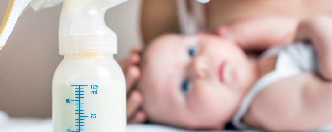 New mom with new born and breast pump