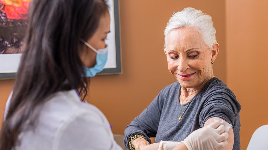 Renown Pharmacist prepping patient for flu shot