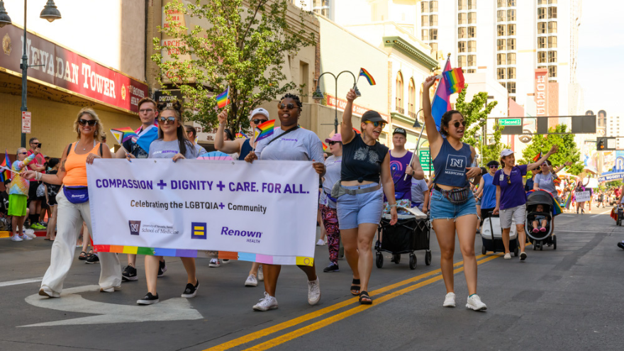 Team Renown and Team UNR Med march in the 2023 Northern Nevada Pride Parade.