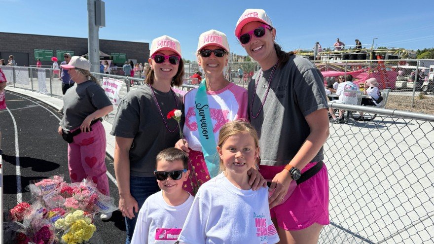 Amanda and family posing at moms on the run