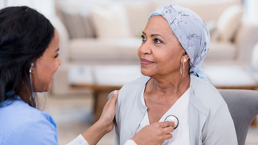 Provider listening to a woman's heart
