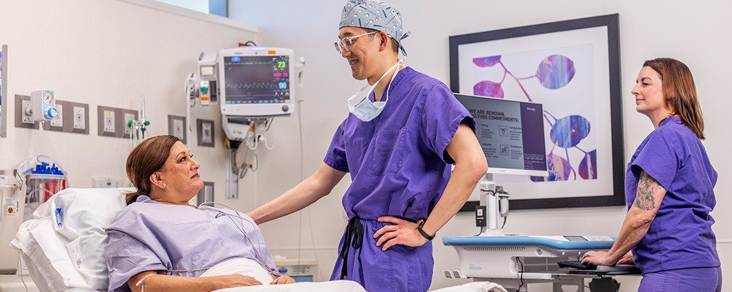 Eric H Kim, MD, chats with patient at Renown Health