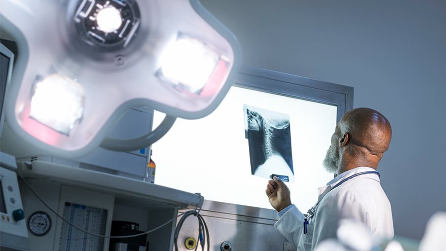 Doctor inspecting an X-ray