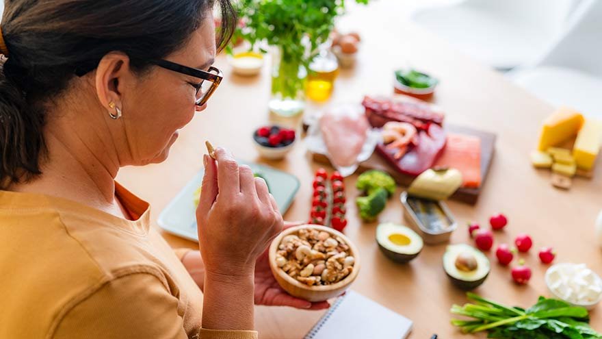 Woman preparing and eating healthy food