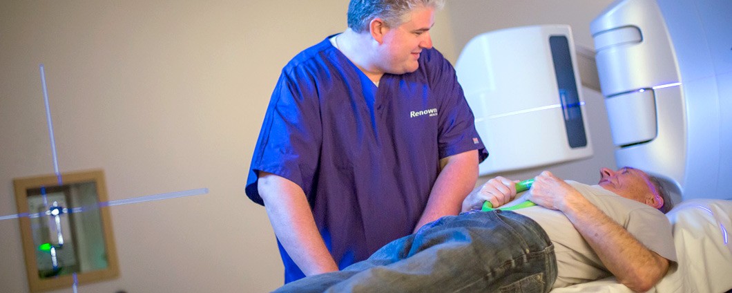 Patient at imaging appointment speaking with imaging technician