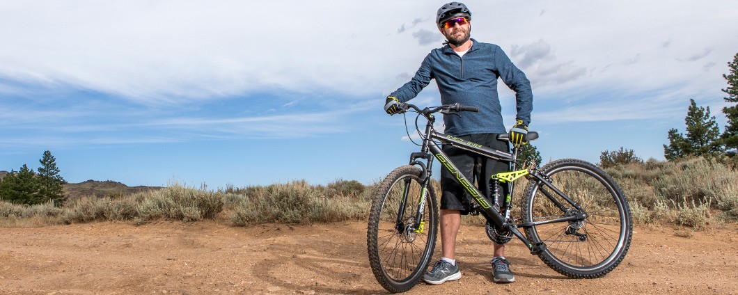 Mountain biker pausing at the top of a hill in Reno Nevada