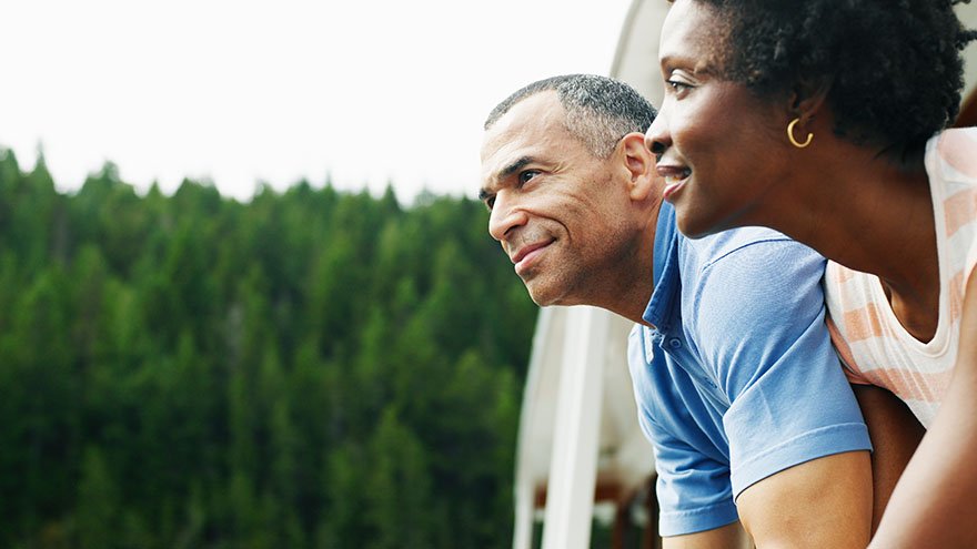 Couple looking out into nature from boat