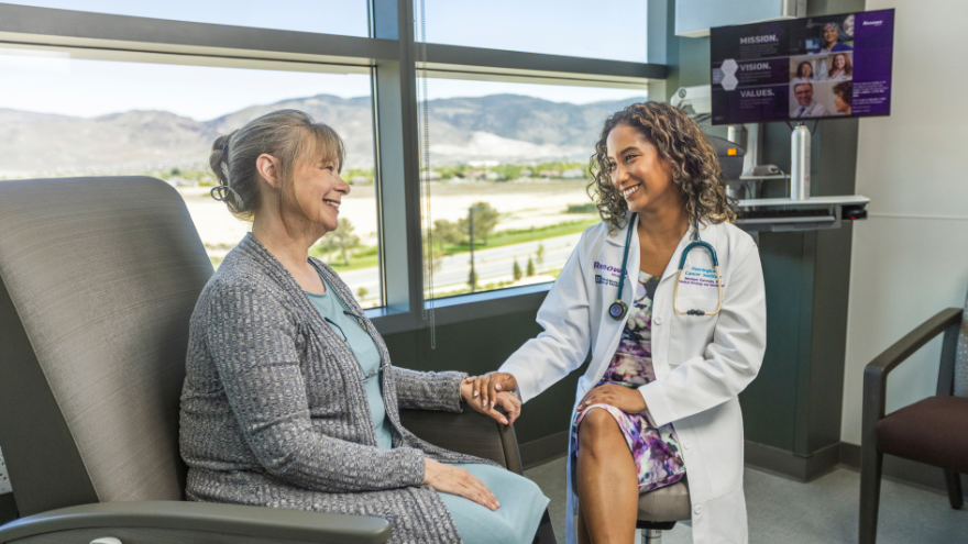 A female patient speaks with a doctor at the conrad breast center