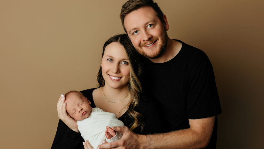 Woman and Man Holding Baby