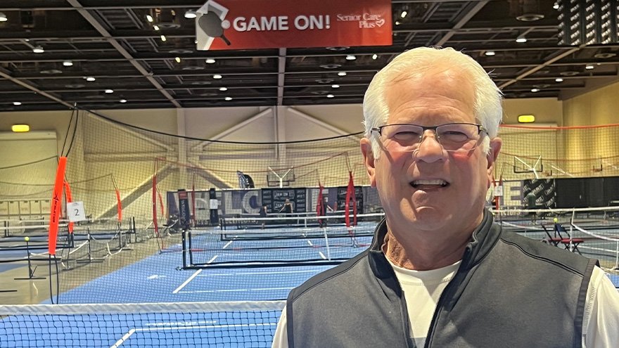 Senior Care Plus member Ralph Barbato standing in pickleball court