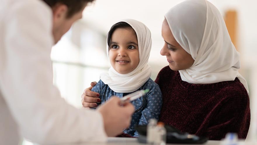 provider examining child with parent