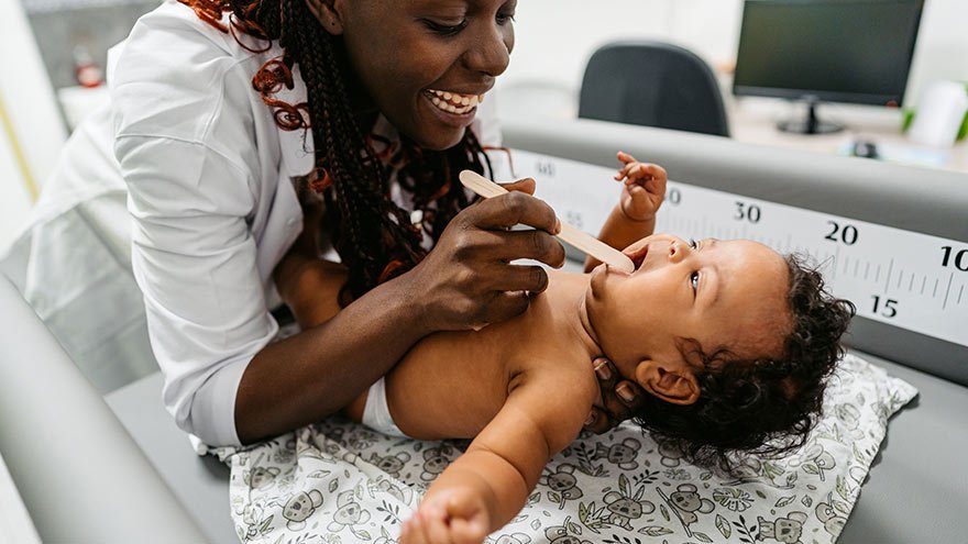Newborn Baby Boy Having A Throat Exam At The Pediatric Clinic