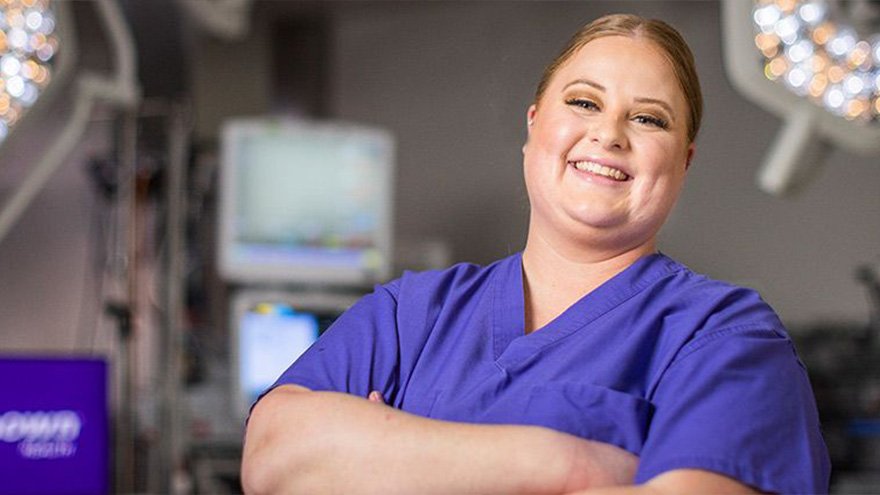 Renown employee smiling in operating room