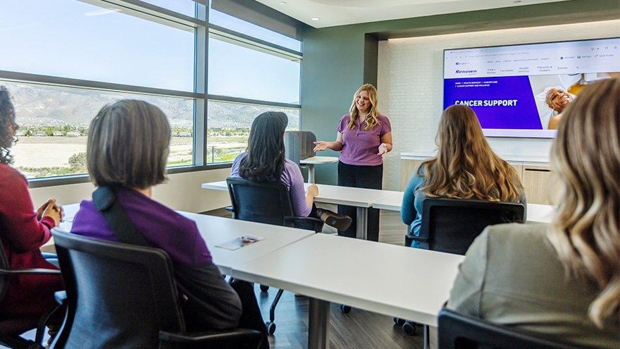 Instructor teaching students about cancer support