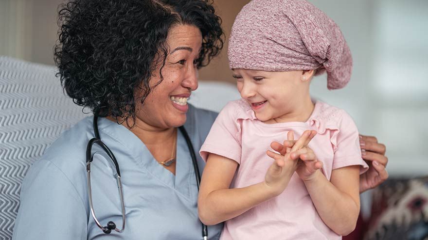 Pediatric cancer patient with nurse