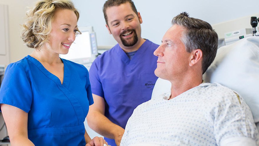 Renown surgical team talking with patient