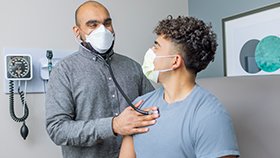 Dr. Reddy examining patient at Carson City primary care
