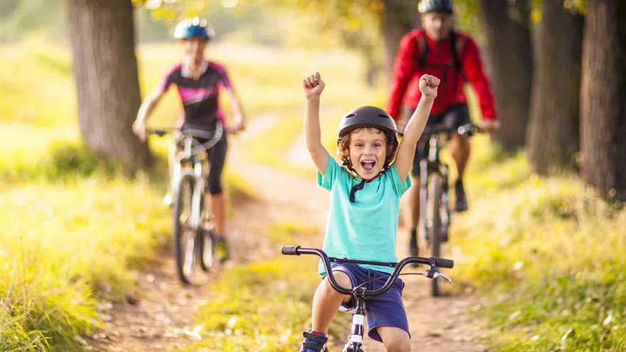 A child cycling outdoors